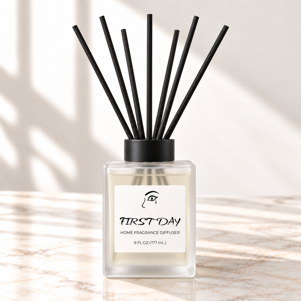 First Day home diffuser with taller frosted bottle and original front label on white marble