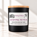 Beautiful Fiction Signature candle on bright ivory marble tabletop