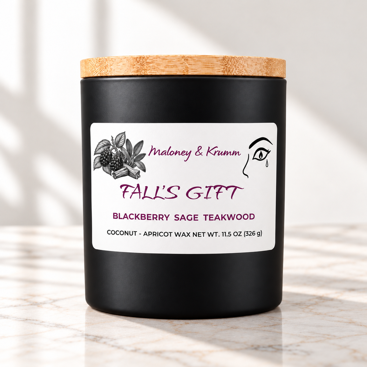 Fall's Gift Signature candle on bright ivory marble tabletop
