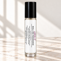 Grace 10 mL roll-on fragrance with full warning label on ivory marble and white background