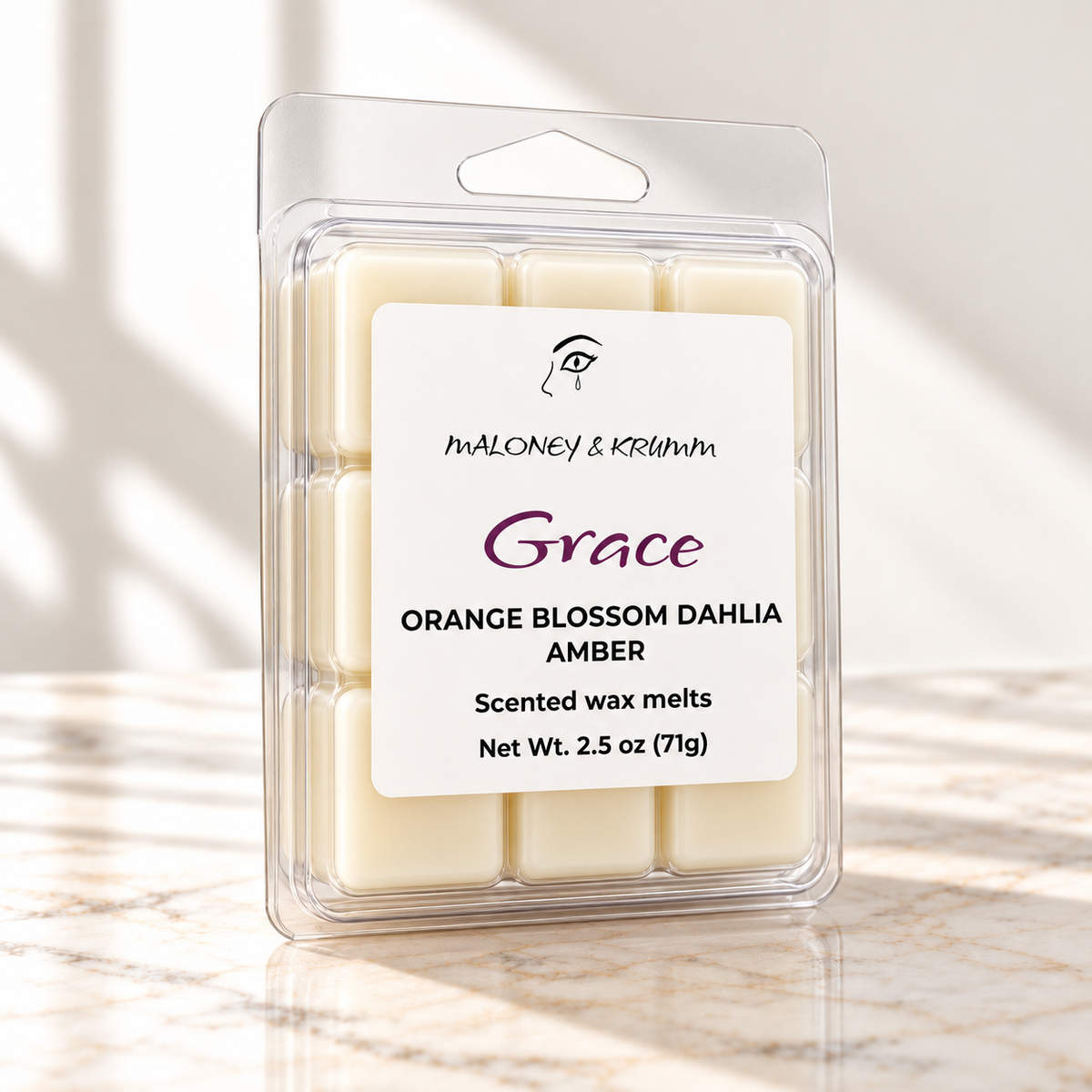 Grace wax melts with front label on white marble