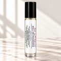 No Witness 10 mL roll-on fragrance with full warning label on ivory marble and white background