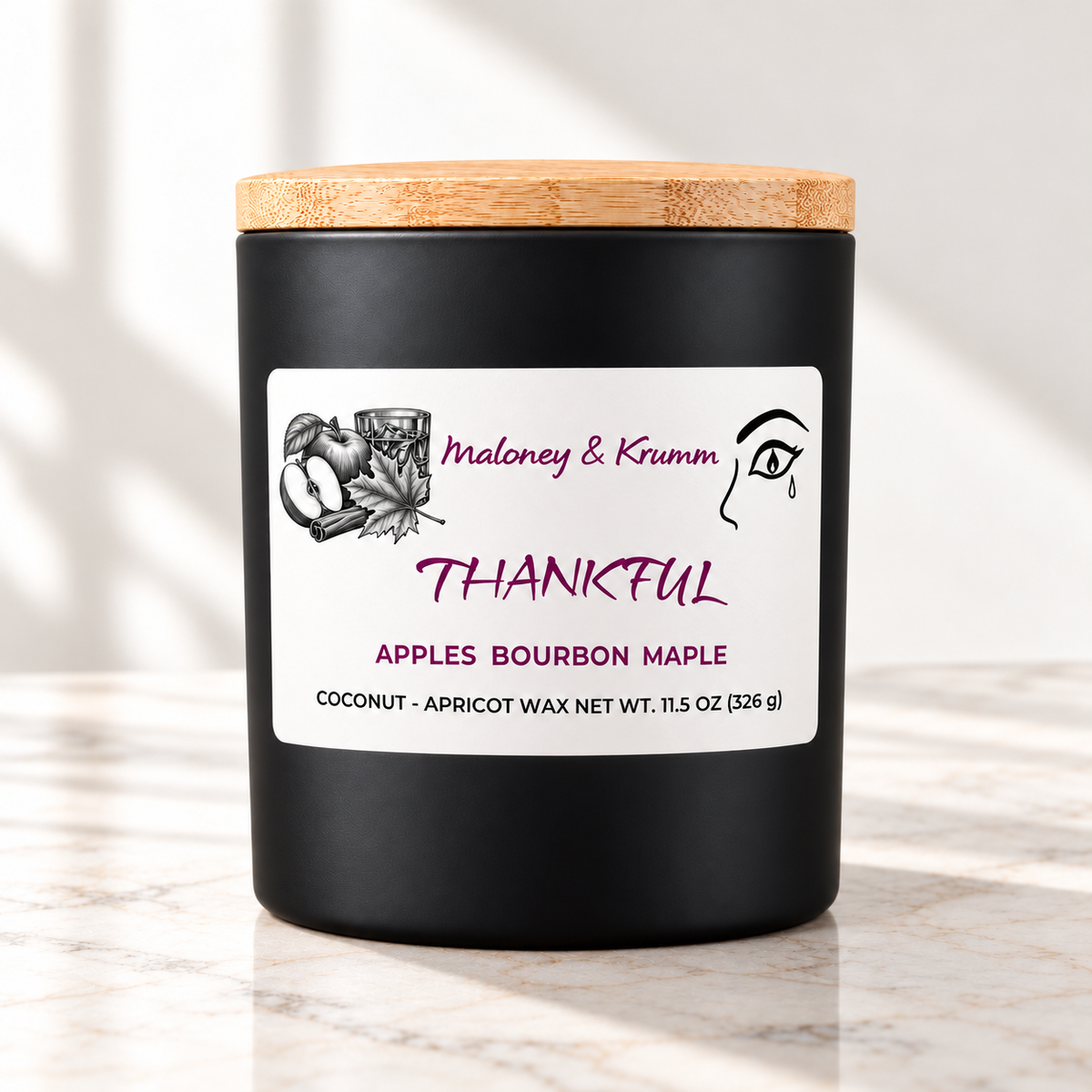 Thankful Signature candle on bright ivory marble tabletop