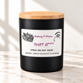 That B**** candle in matte black jar on ivory marble with white background