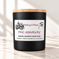 The Runaway candle in matte black jar on ivory marble with white background