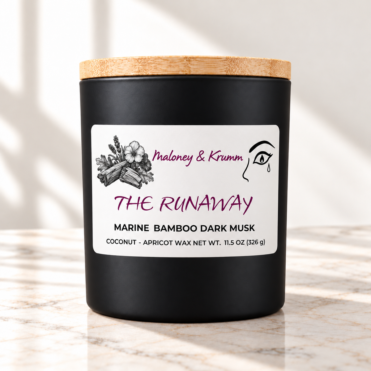 The Runaway candle in matte black jar on ivory marble with white background
